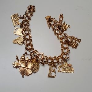 Beautiful 14kt gold bracelet with charms.